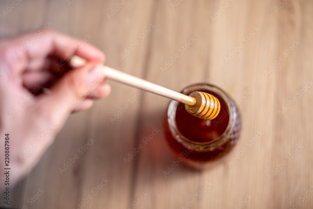 honey and wooden spoon