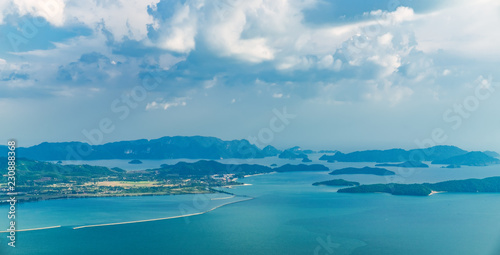 View of blue sky, sea and mountain seen from Cable Car viewpoint, Langkawi, Malaysia. Picturesque landscape with tropical forest, beaches, small Islands in waters of Strait of Malacca
