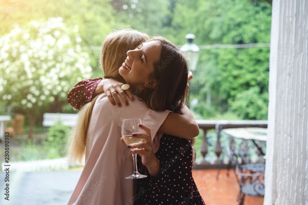Obraz premium Two girls on the terrace