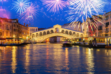 view of famouse Rialto bridge at night with fireworks, Venice, Italy
