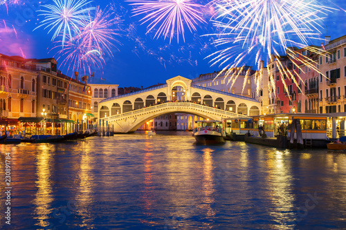 view of famouse Rialto bridge at night with fireworks, Venice, Italy