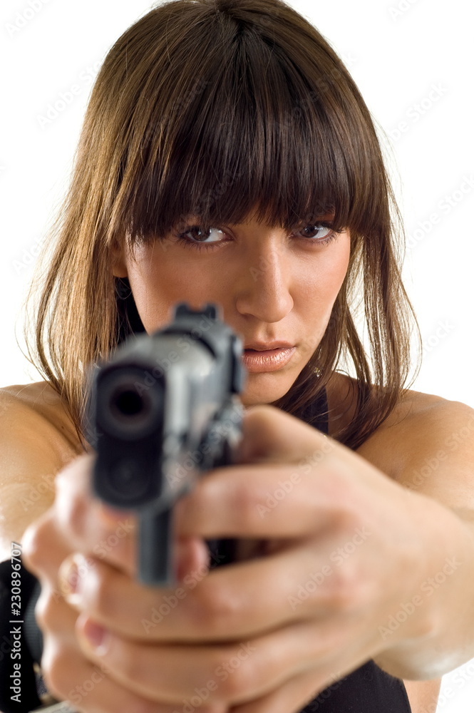 Beautiful girl with gun on white background is insulated Beautiful girl with gun on white background is insulated