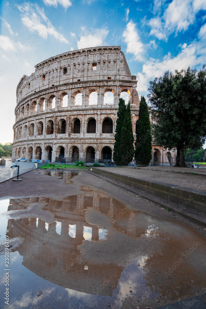 ruins of antique Colosseum with reflection, Rome Italy