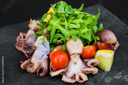 Fototapeta Naklejka Na Ścianę i Meble -  Salad with octopus and greens