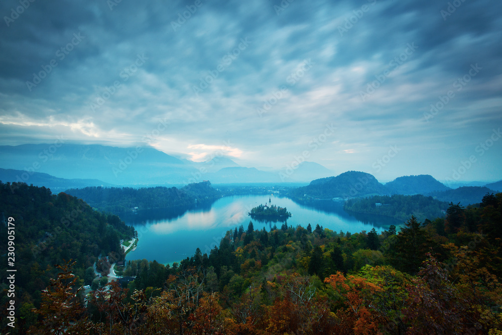 Panoramic view of amazing Bled Lake in Slovenia in autumn time with beautiful clouds in background.