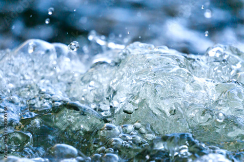 Tiny air bubbles on the water surface, close-up, background image