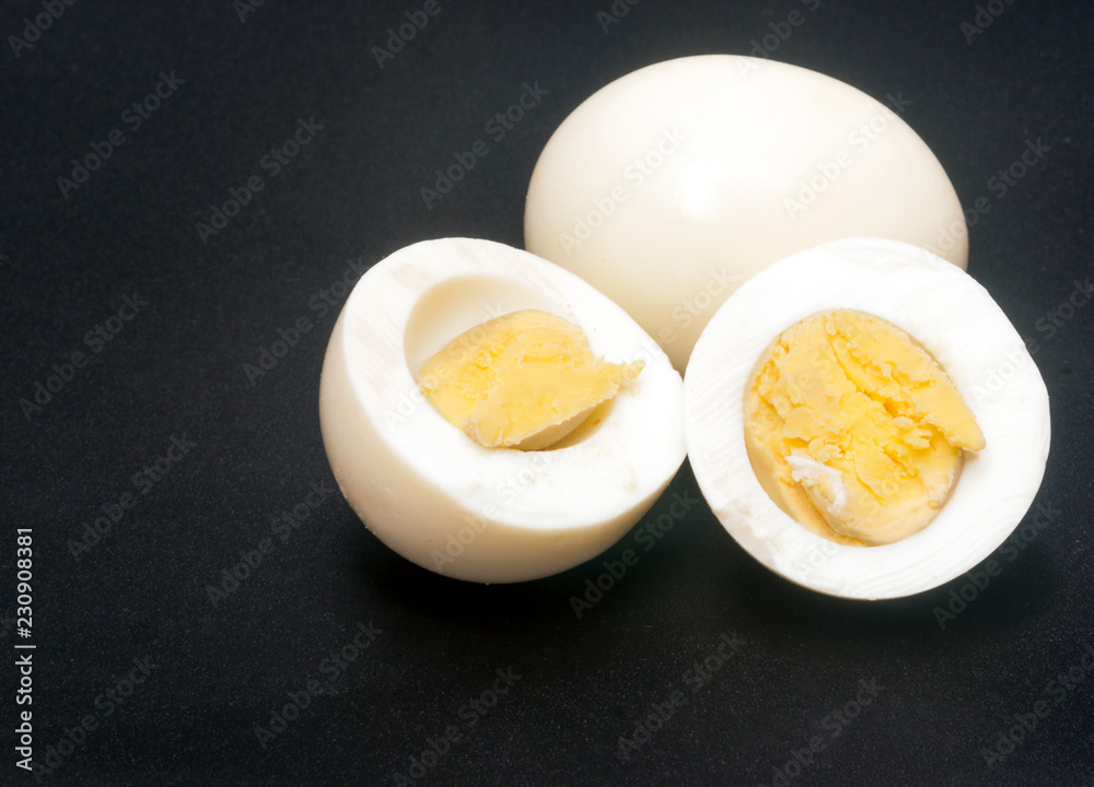 Cooked eggs surrounded by black background