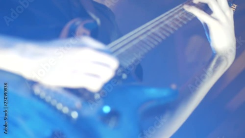 hard strobe lights during the guitar solo at a live show photo