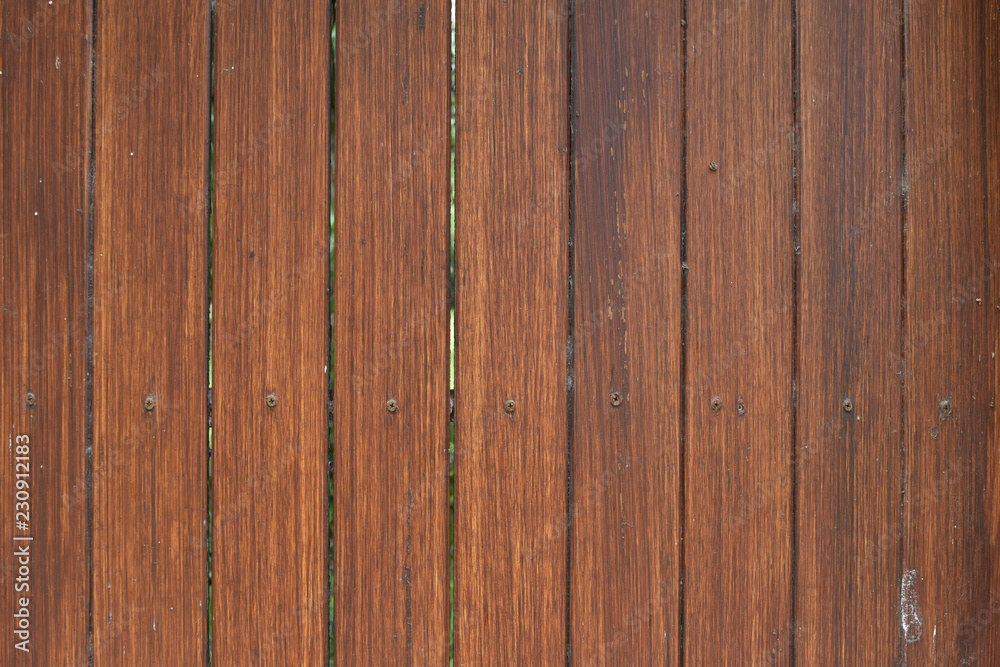 Naklejka premium brown plank wooden .vertical, wood surface for background and wallpaper
