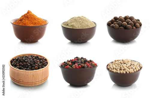 Set with powders and pepper corns on white background