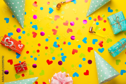 Birthday banner or background, gift, carnival cap, confetti. Flat style. Copy space for greeting text.