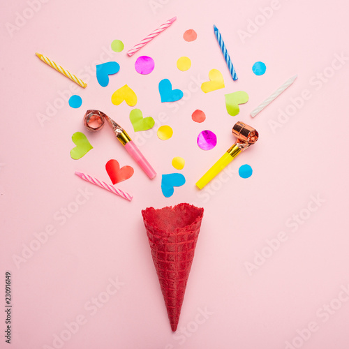 Celebration, party concept idea with colorful confetti, on pink background.Flat lay design