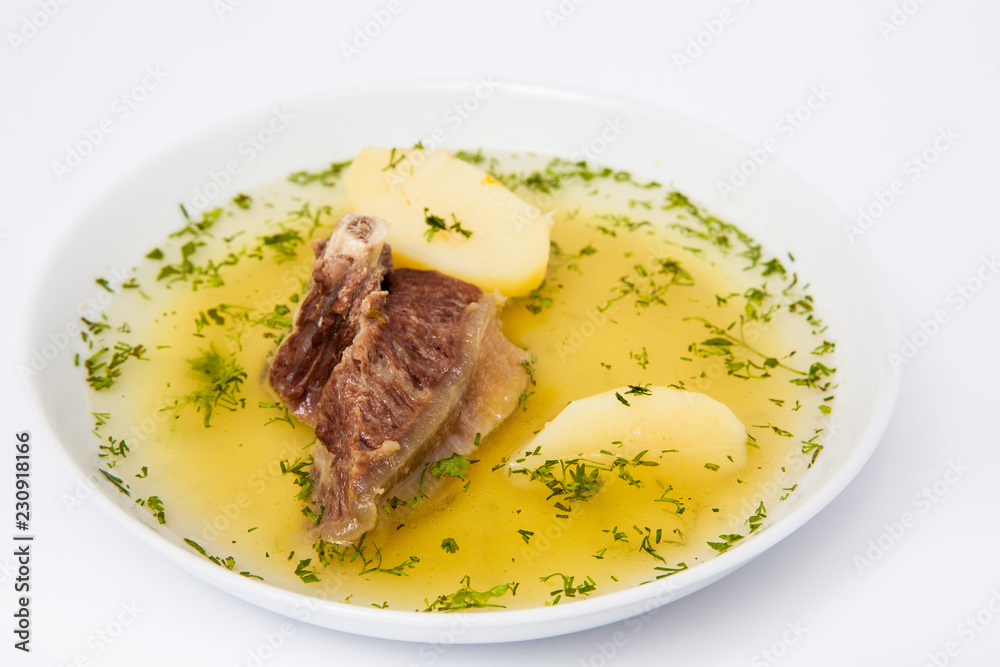 Traditional Colombian beef rib broth isolated on white background Traditional Colombian beef rib broth isolated on white background