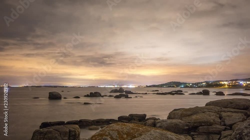 starlapse stars night sea coast photo