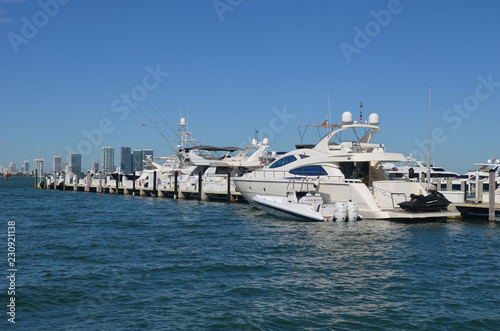 High-end white motor yacht moored at a marina in the south beach section of Miami Beach,Florida