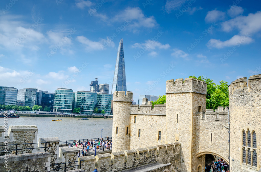 LONDON, UNITED KINGDOM - July 12, 2018 : Tourists at The Tower of London, officially Her Majesty's Royal Palace and Fortress of the Tower of London, is a historic castle located on the River Thames.