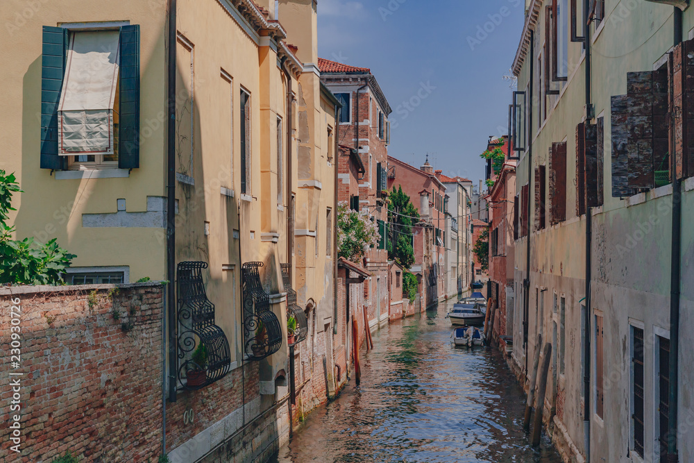 Venetian houses and canal in Venice, Italy