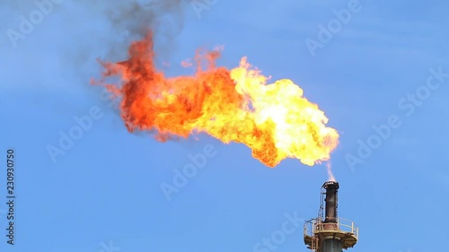 Fire on flare stack at oil and gas central processing platform release over pressure from process. Petroleum refinery plant