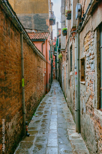 Venetian houses and alley in Venice, Italy