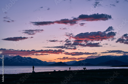 Mongolian dwellers are fishing on Hoton-nuur lake in sunset time