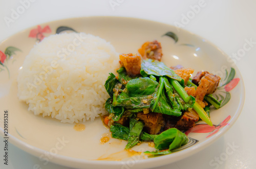 Kale with crispy pork on rice