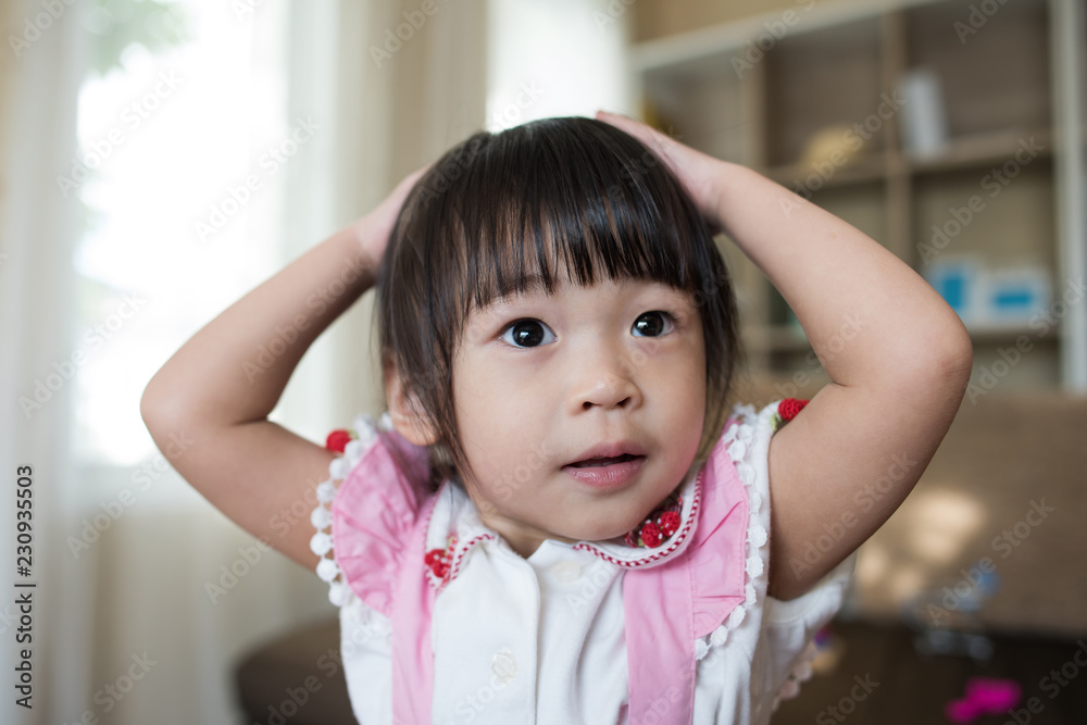 Portrait of Little asian girl playing in her home Portrait of Little asian girl playing in her home