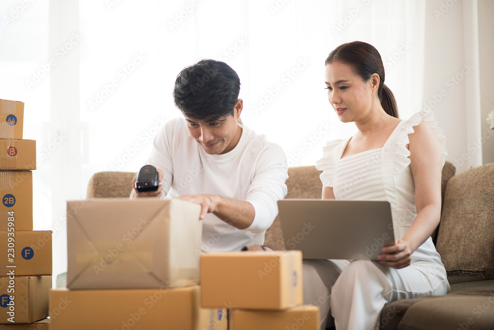 Happy couple at Home office with Online business, Marketing online and freelance job Happy couple at Home office with Online business, Marketing online and freelance job