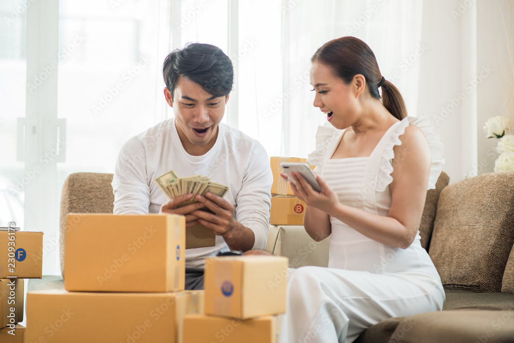 Happy couple at Home office with Online business, Marketing online and freelance job Happy couple at Home office with Online business, Marketing online and freelance job