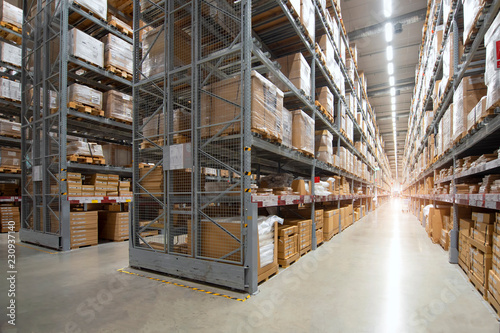 Huge distribution warehouse with high shelves photo