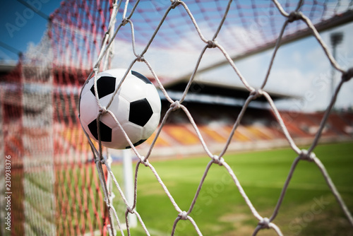 Soccer into goal success concept © Johnstocker