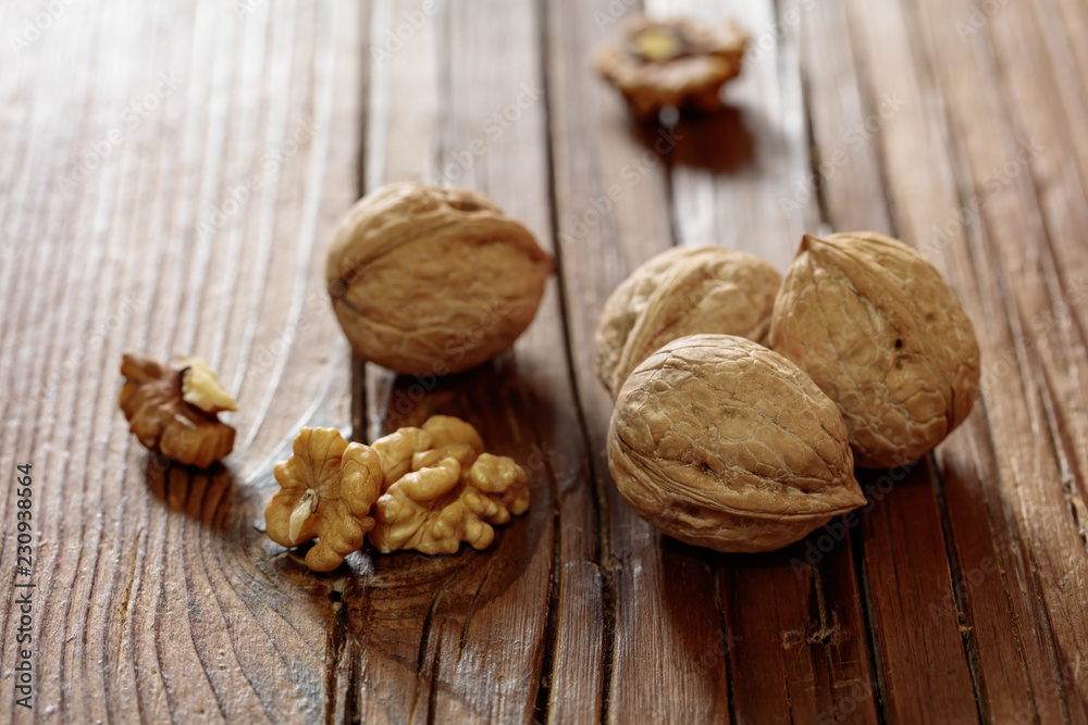walnuts on wooden background walnuts on wooden background