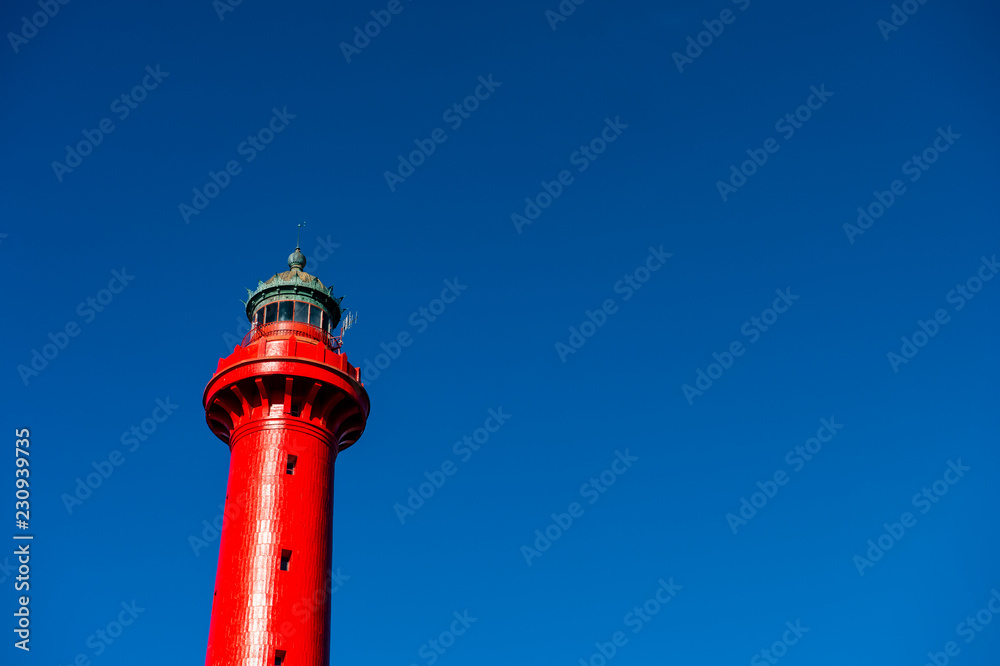 Lighthouse red and white at the French west beach, in Charente maritime coast