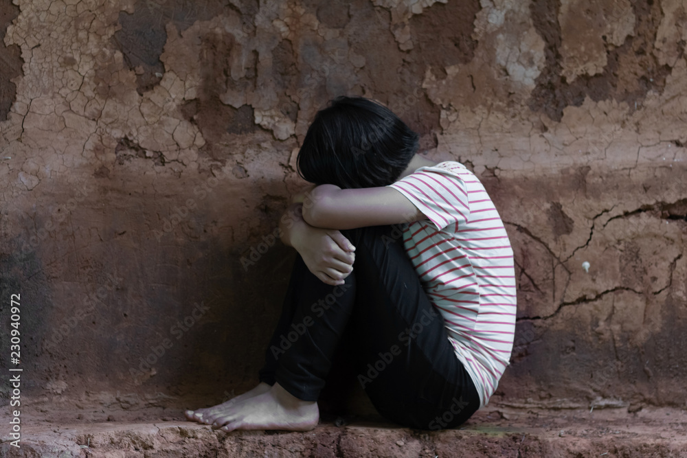 young girl shouts covered her face with her hands. Stop violence against women and children