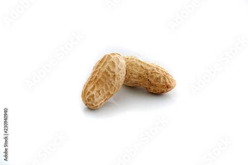 Peanuts.  unpeeled nuts isolated on white background. Peanut macro. Selective Focus