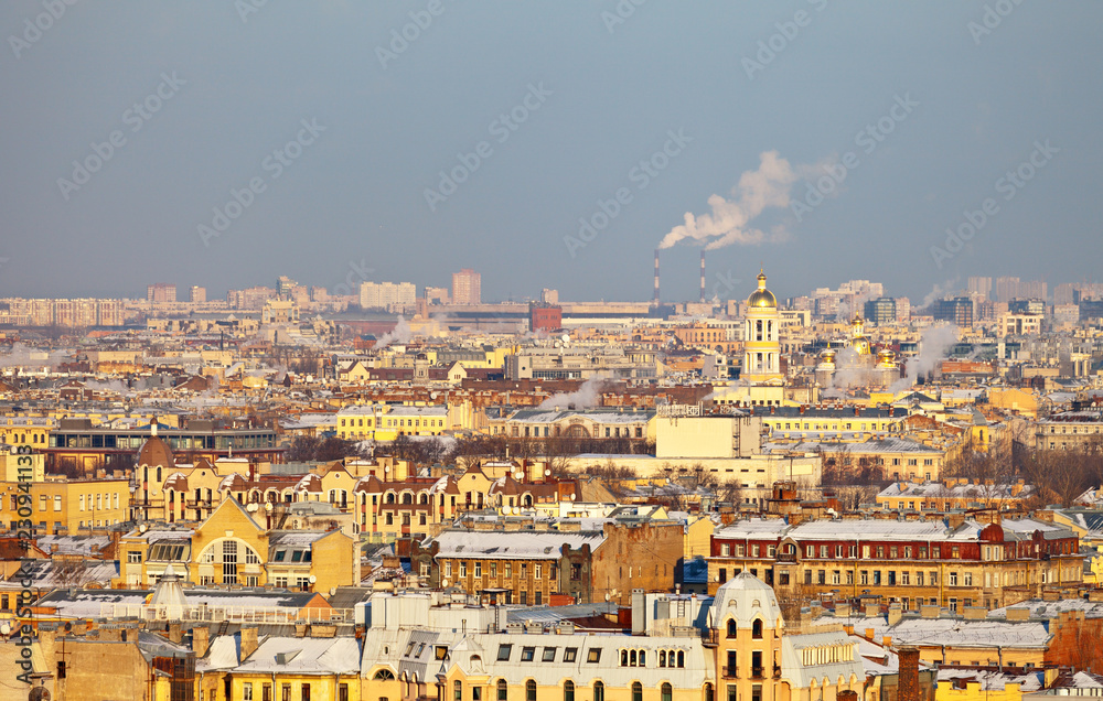 St. Petersburg. Top view of the roofs of the historic center of the city and the bell tower of the Our Lady of Vladimir Church on a frosty winter day