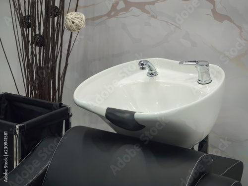 White sink to wash it at the hairdresser's.