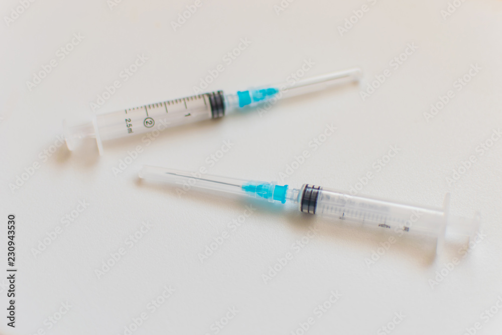 Different syringes on a white background. Different syringes on a white background.