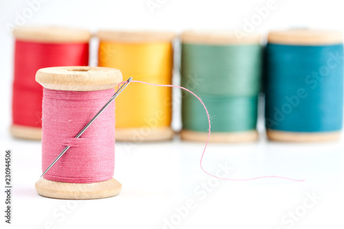 Old wooden coils of thread.