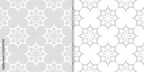 Light gray floral backgrounds. Set of seamless patterns
