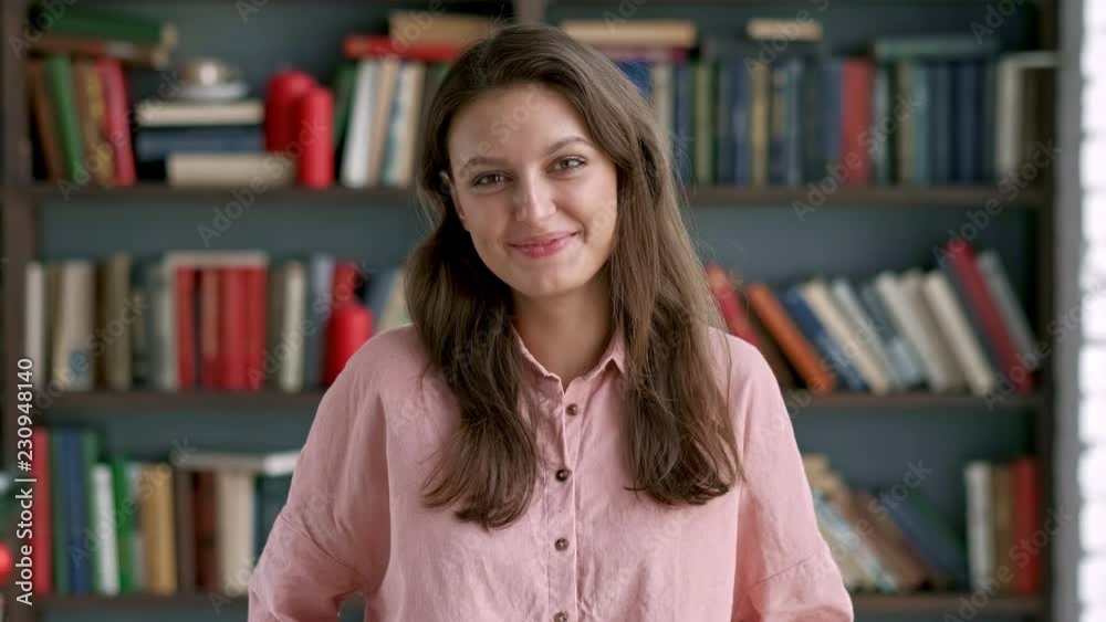 close up portrait of young pretty librarian woman smiling happy looking at camera in library bookshelf background knowledge learning close up portrait of young pretty librarian woman smiling happy looking at camera in library bookshelf background knowledge learning