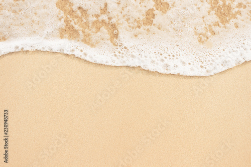 Fototapeta Naklejka Na Ścianę i Meble -  Soft ocean wave on sandy beach background