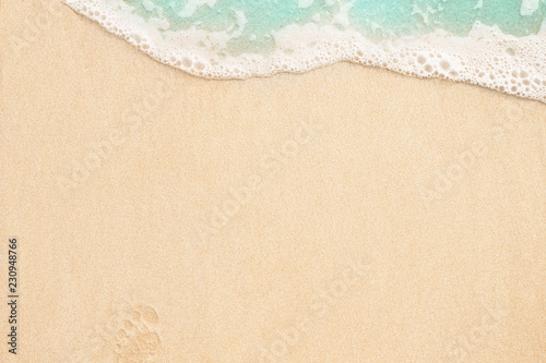 Beautiful soft wave on the sandy beach background
