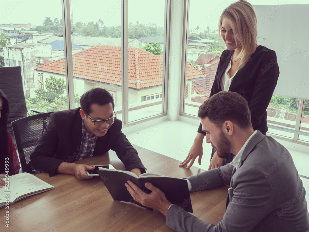 business people in meeting room,Businessman explaining new business ideas business people in meeting room,Businessman explaining new business ideas