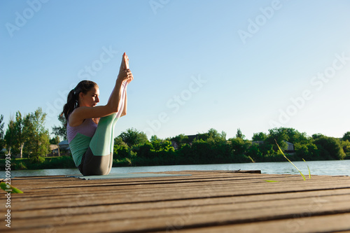 Woman Yoga Exercises Outdoor