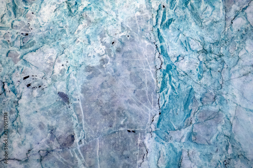 Multicolored layered marble texture with different veins and scratches, may be used as background