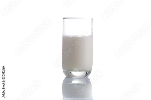 fresh milk in the glass on white background, isolated photo