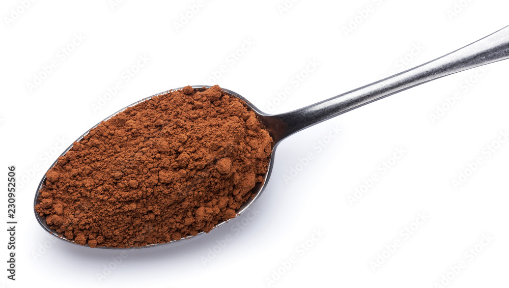 Cocoa powder in spoon isolated on white background. Top view Cocoa powder in spoon isolated on white background. Top view