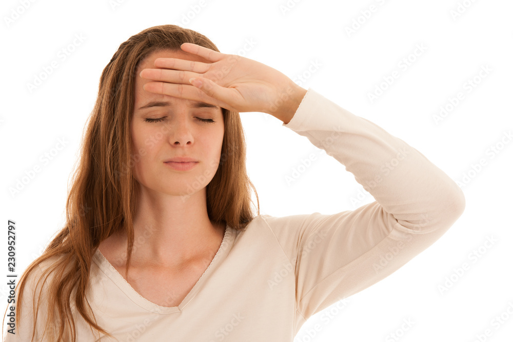Beautiful young brunette woman holds her head as she has headache - illness Beautiful young brunette woman holds her head as she has headache - illness