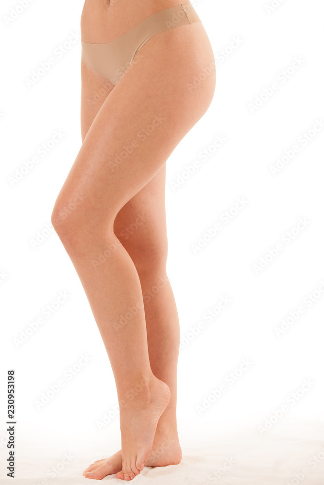 Beautiful long slim and elegant woman legs isolated over white background Beautiful long slim and elegant woman legs isolated over white background