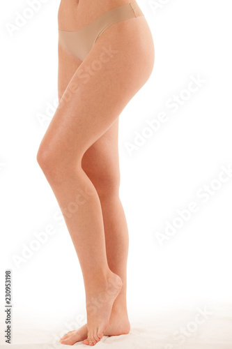 Beautiful long slim and elegant woman legs isolated over white background